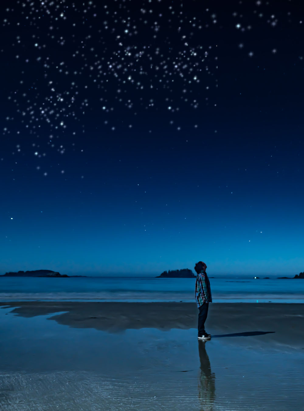 watching stars at the night sky, night sky watch, watching stars at night, a boy sitting at the beach and watching stars in the sky